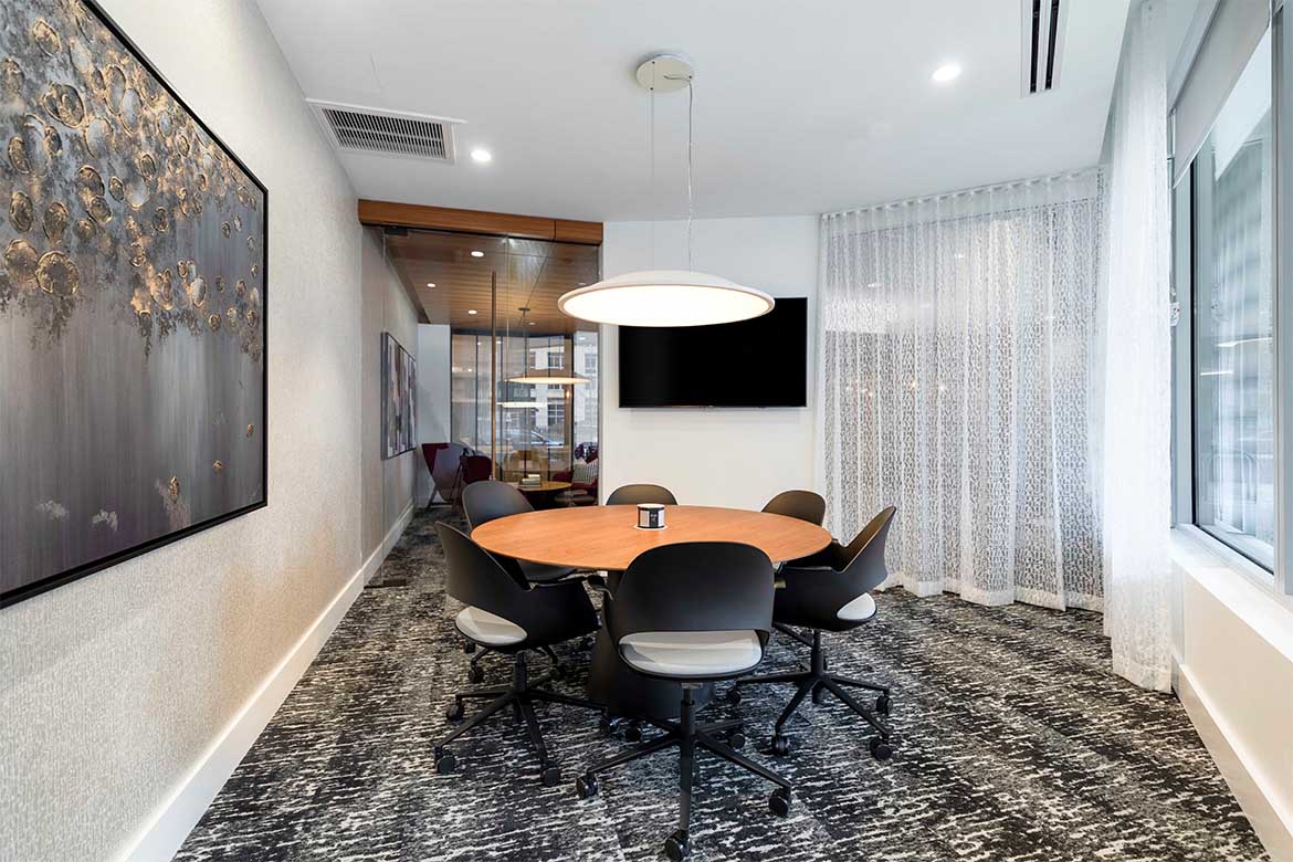 a conference room with a table and chairs