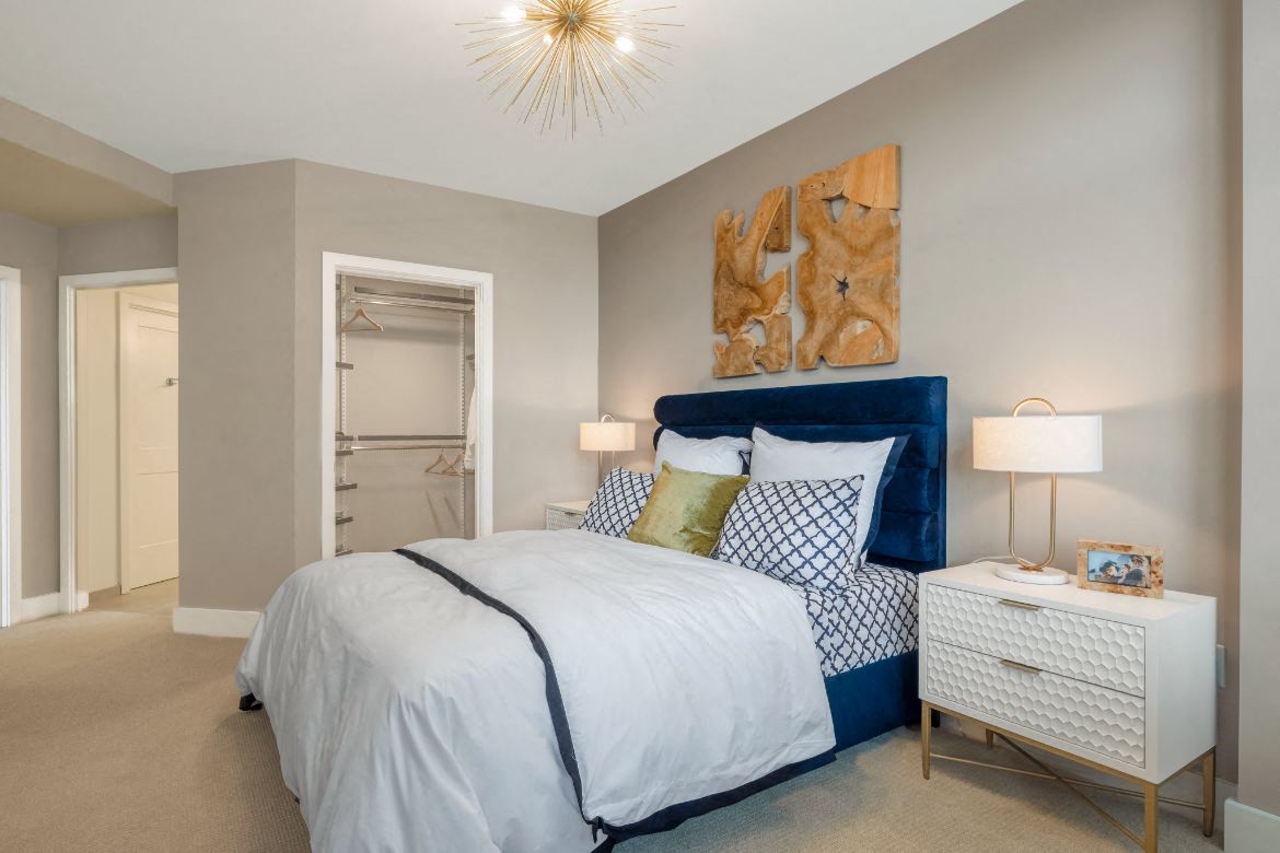 a bedroom with a bed and a closet