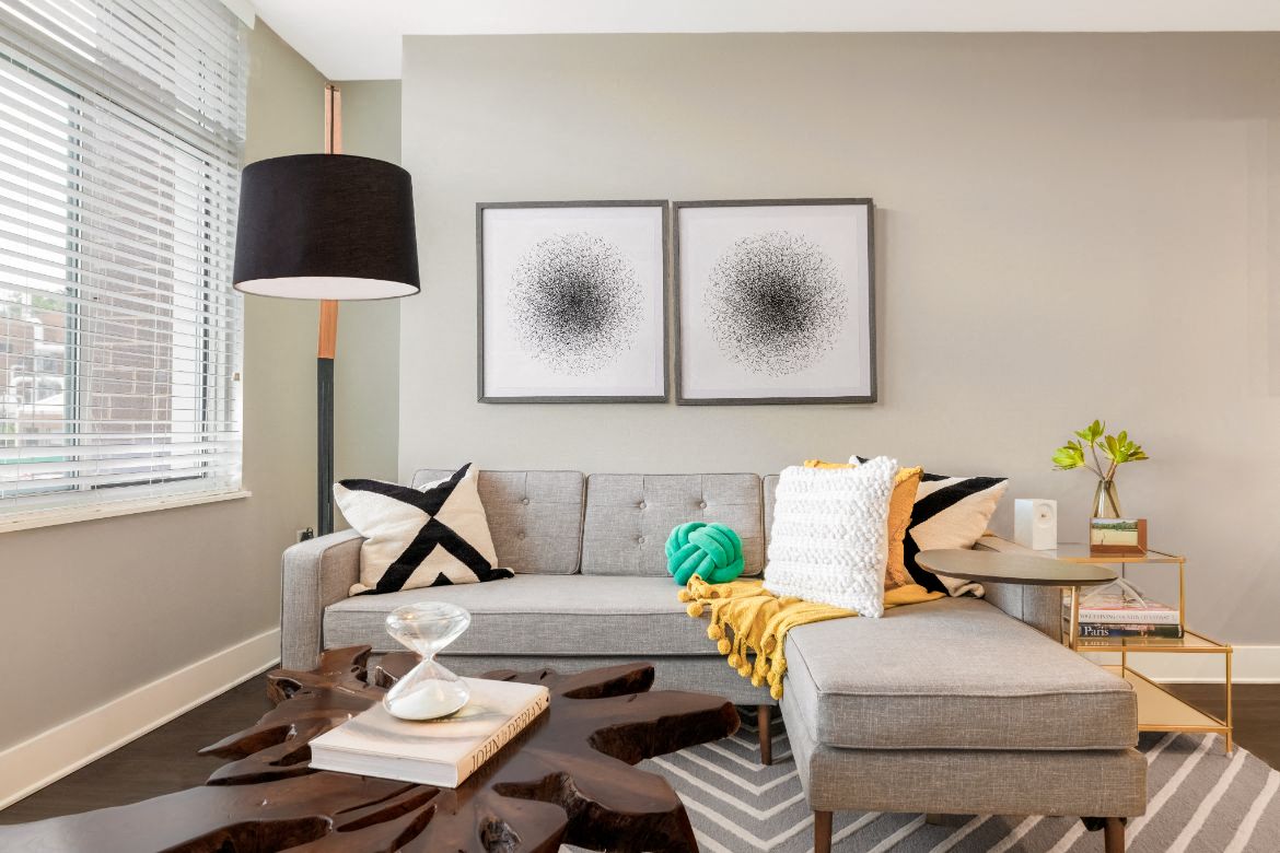 a living room with a couch and a lamp