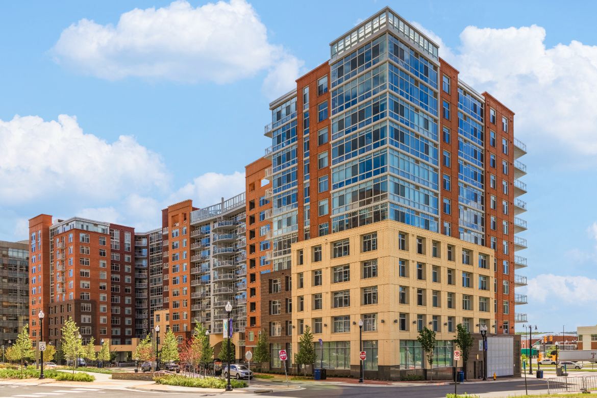 a rendering of an apartment building on a city street