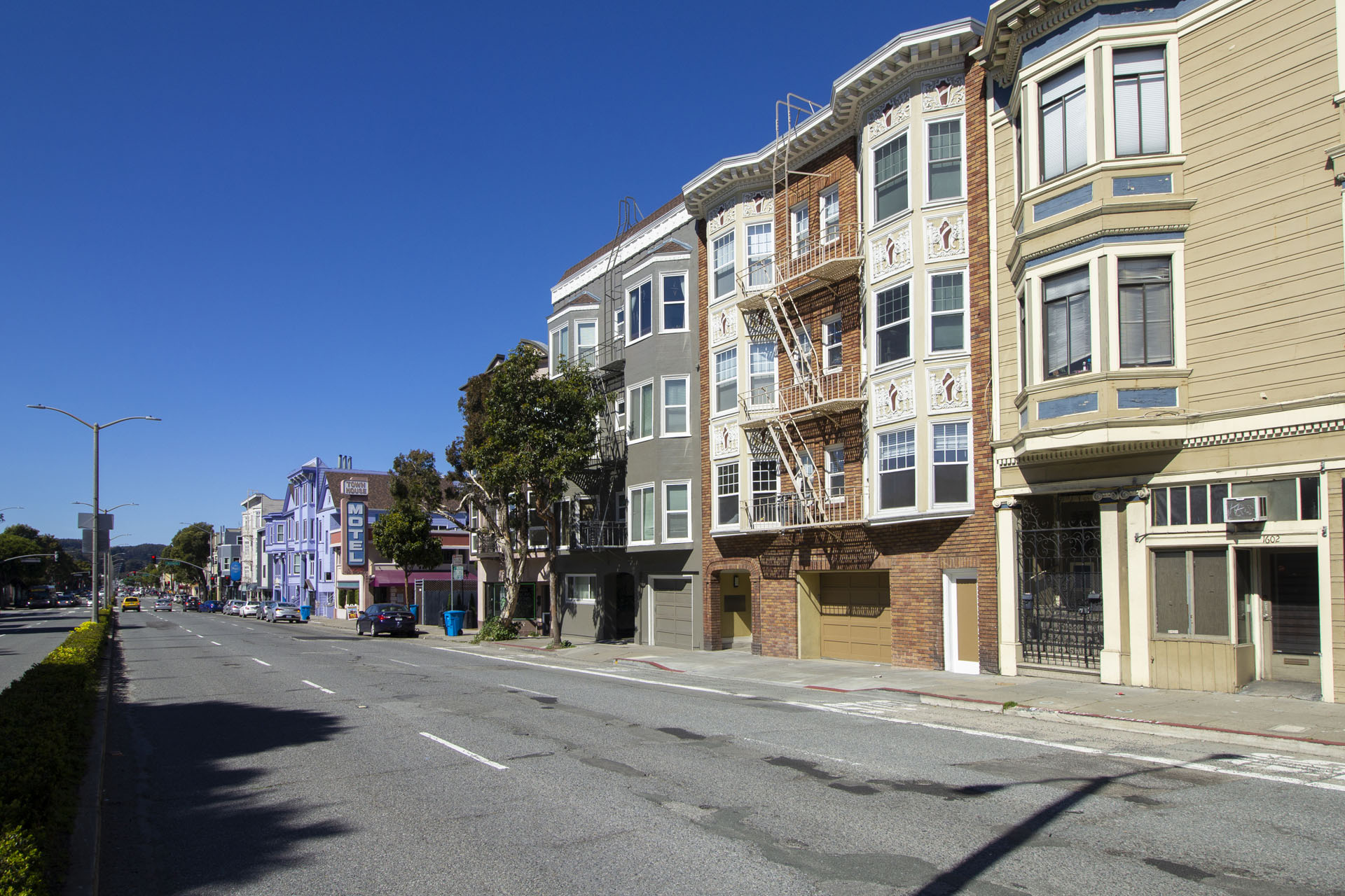 A street with buildings on both sides and no people.