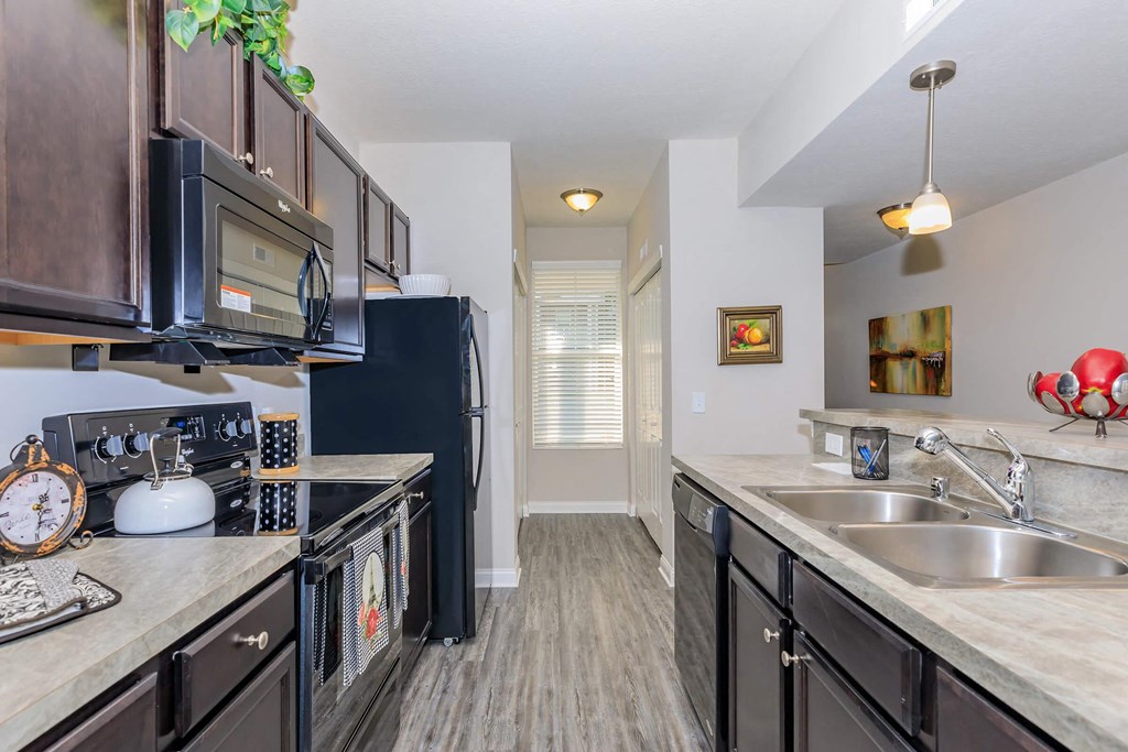 a kitchen with stainless steel appliances and a sink
