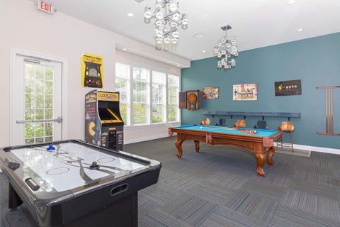 a games room with a pool table and a foosball