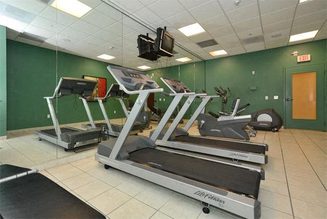 a gym with a bunch of exercise equipment in it