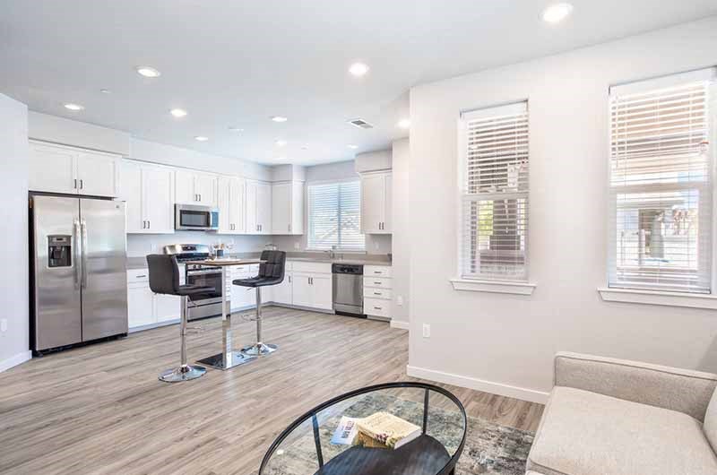 Apartments for Rent in American Canyon - The Village at Vintage Ranch - Kitchen with White Cabinets, Stainless-Steel Appliances, and Granite-Style Countertops