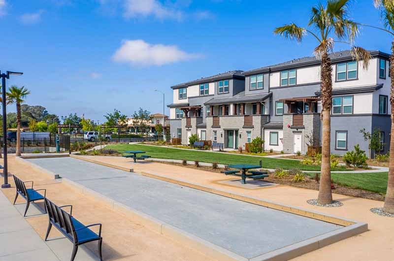 Apartments for Rent American Canyon, CA - Outdoor Community Bocce Area with Plenty of Park Benches Surrounded by Lush Landscaping