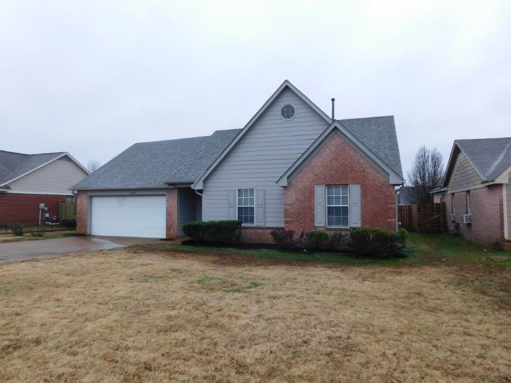 a house with a yard in front of it