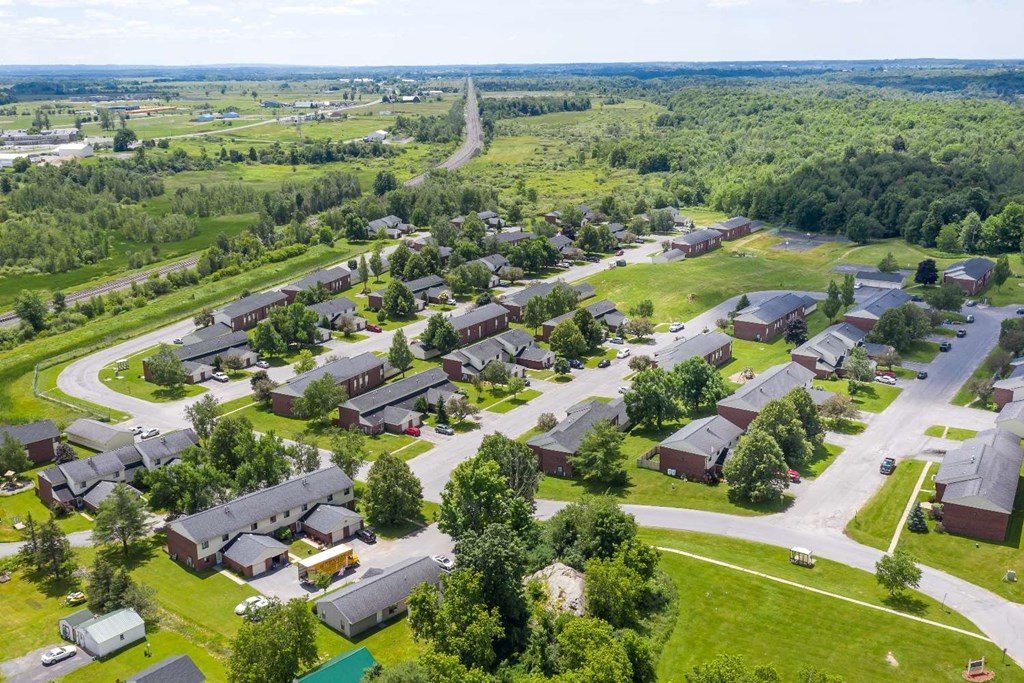 an aerial view of a neighborhood with many houses and trees