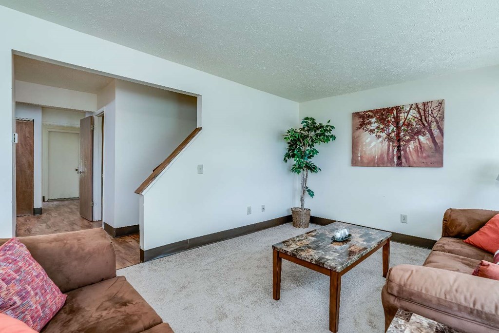 a living room with a couch and a table