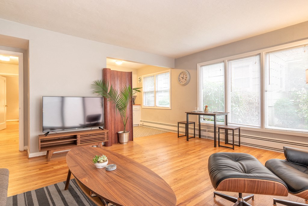 a living room with a television and a table