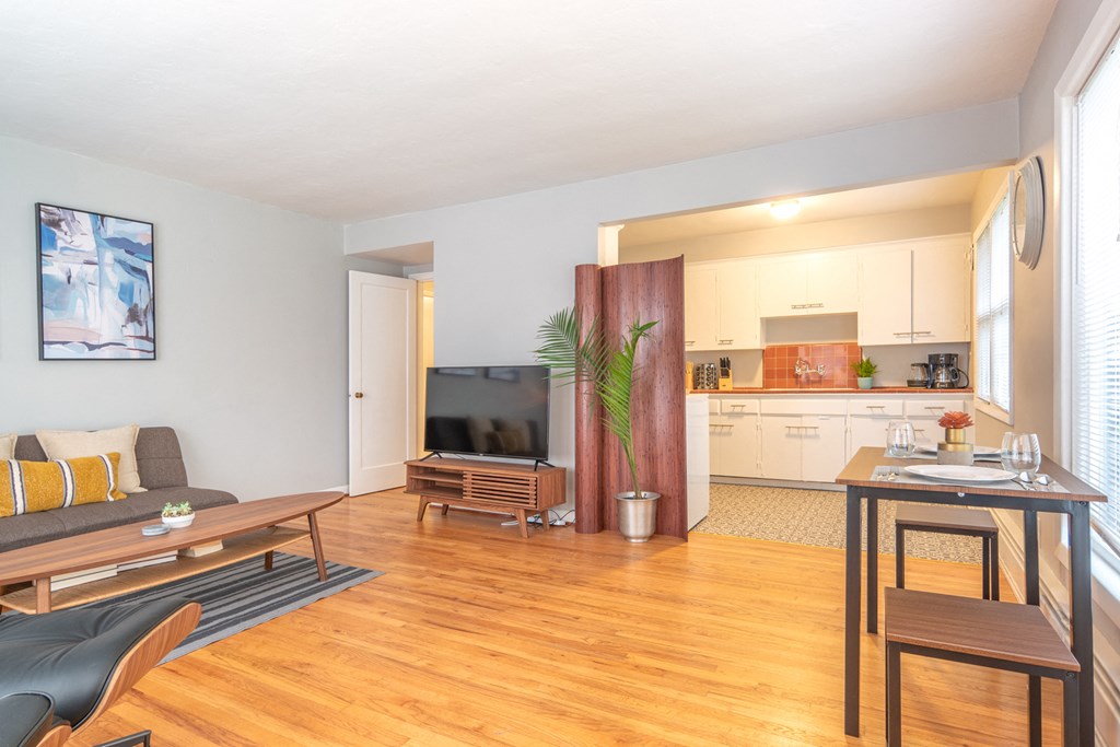 a living room with a couch and a table and a television