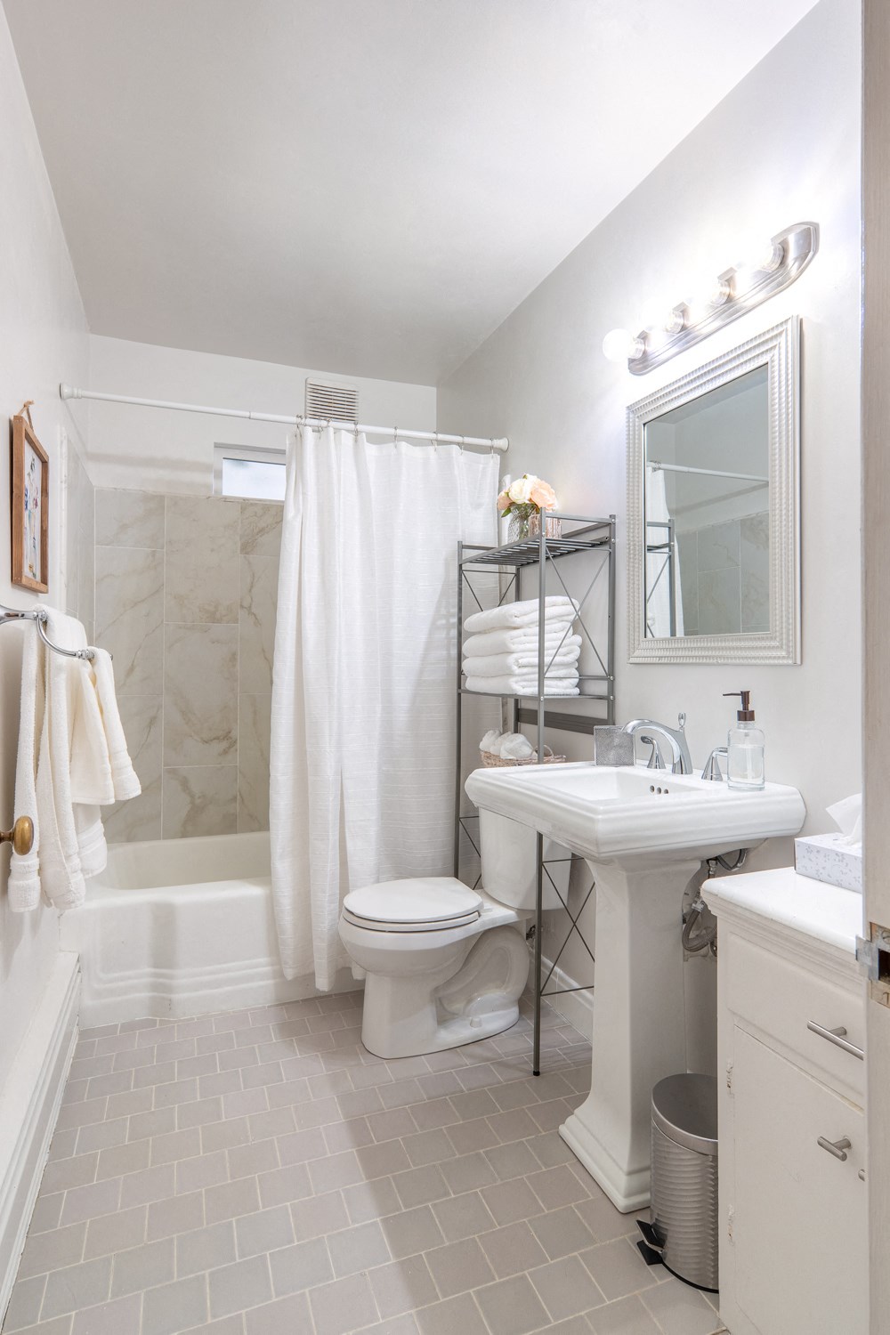 a small bathroom with a sink toilet and shower