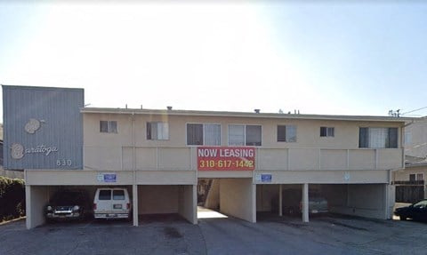 a building with a now leasing sign on it