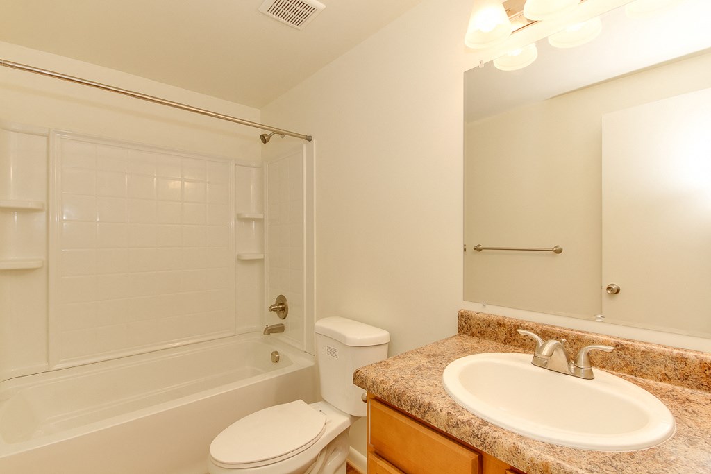 the preserve at ballantyne commons apartment bathroom with sink toilet and shower