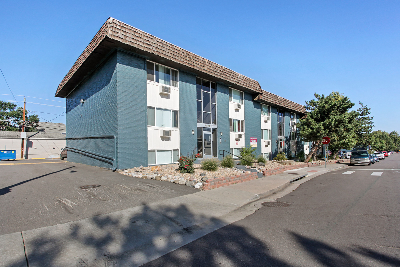 a blue and white building on the corner of a street