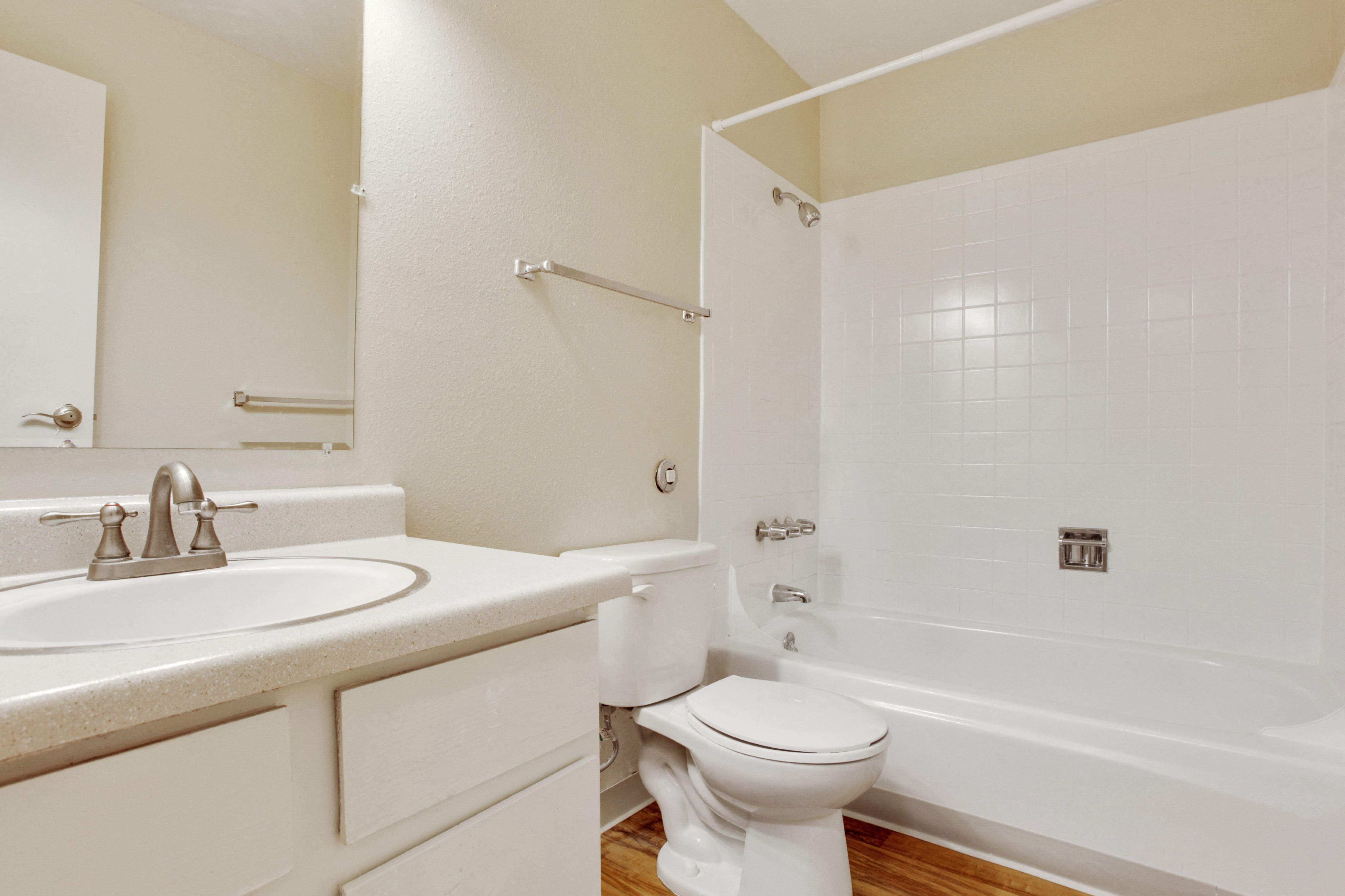 a bathroom with a sink toilet and bath tub