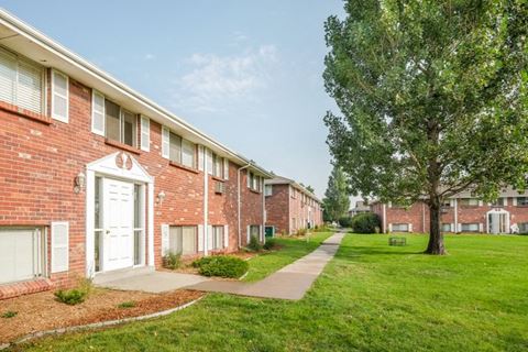 our apartments are located in a quiet neighborhood with a green lawn and trees