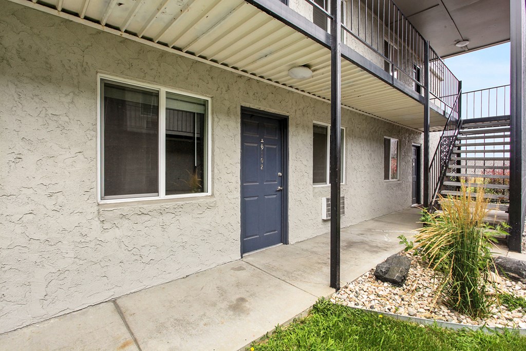 the entrance to a building with a blue door