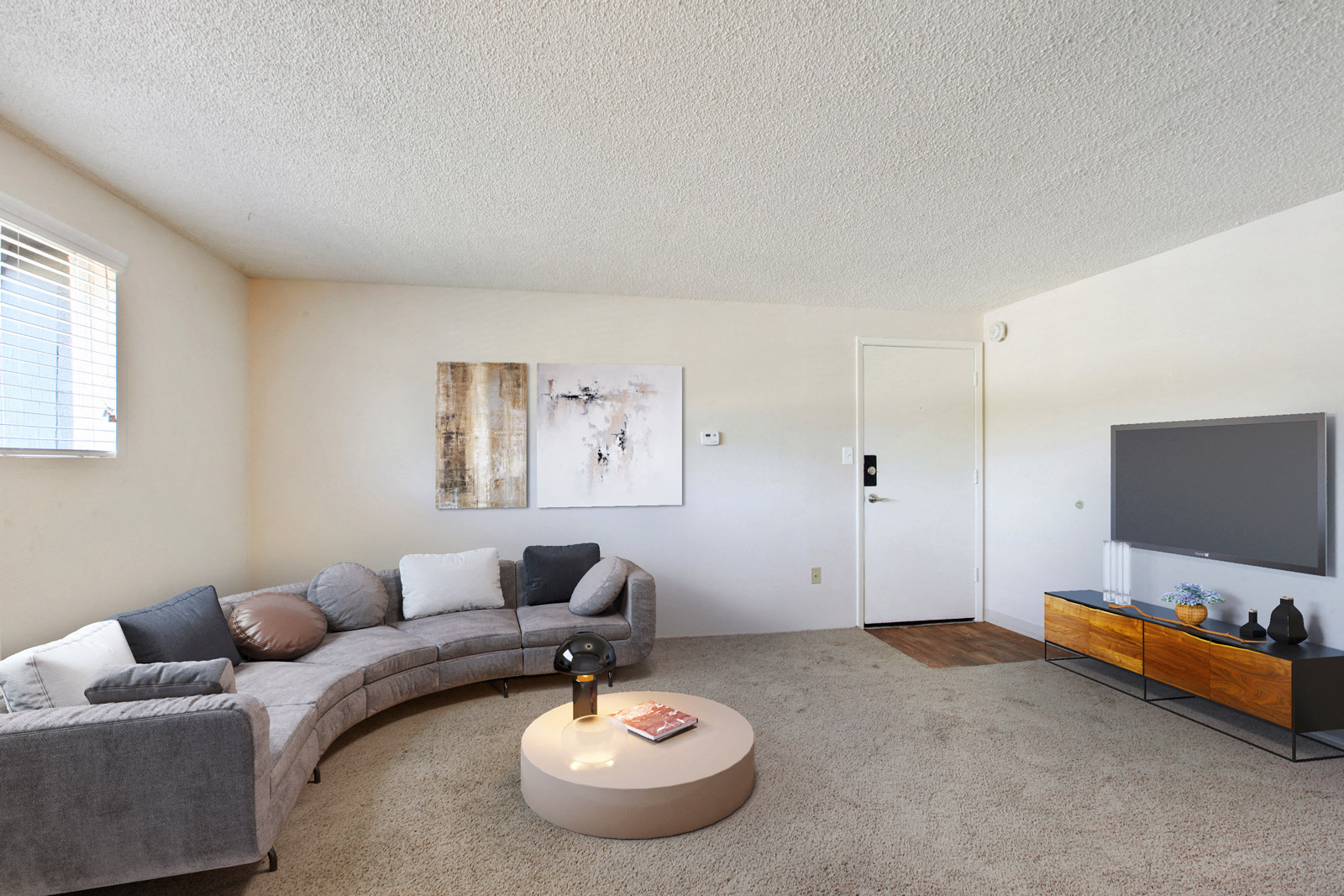 a living room with a couch and a tv