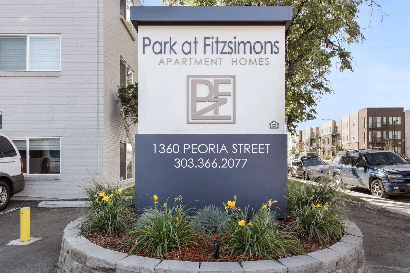 the sign for park of fischmanns apartment homes in front of a building