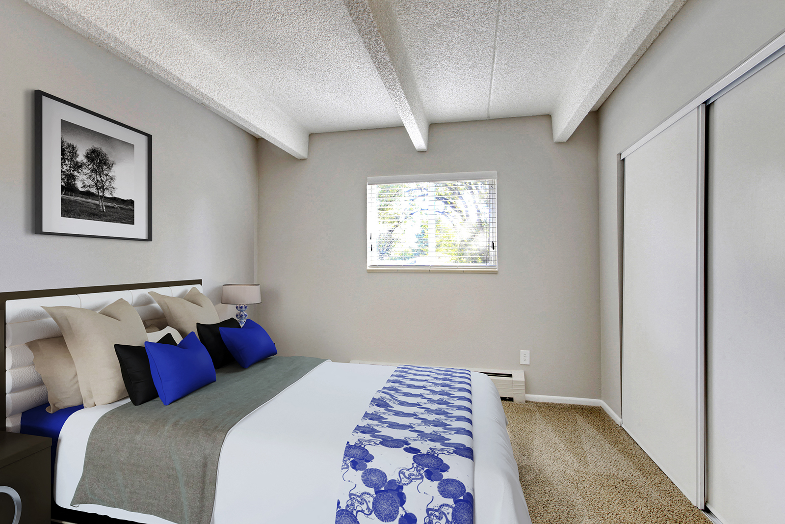 a bedroom with a large bed and a window