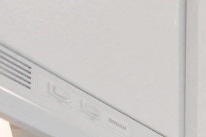 an empty kitchen with white cabinets and white appliances and a sink
