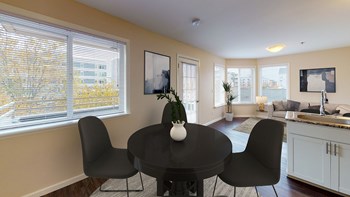 Dining area with a round dining table and 4 chairs. One window in the dining area. - Photo Gallery 2