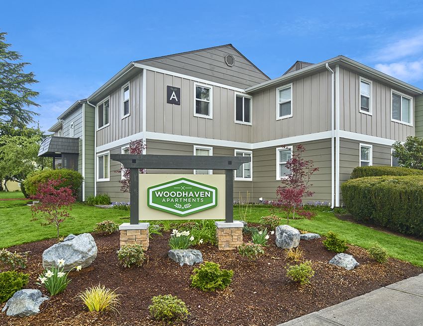Exterior view of building and front sign with well maintained landscaping. - Photo Gallery 1