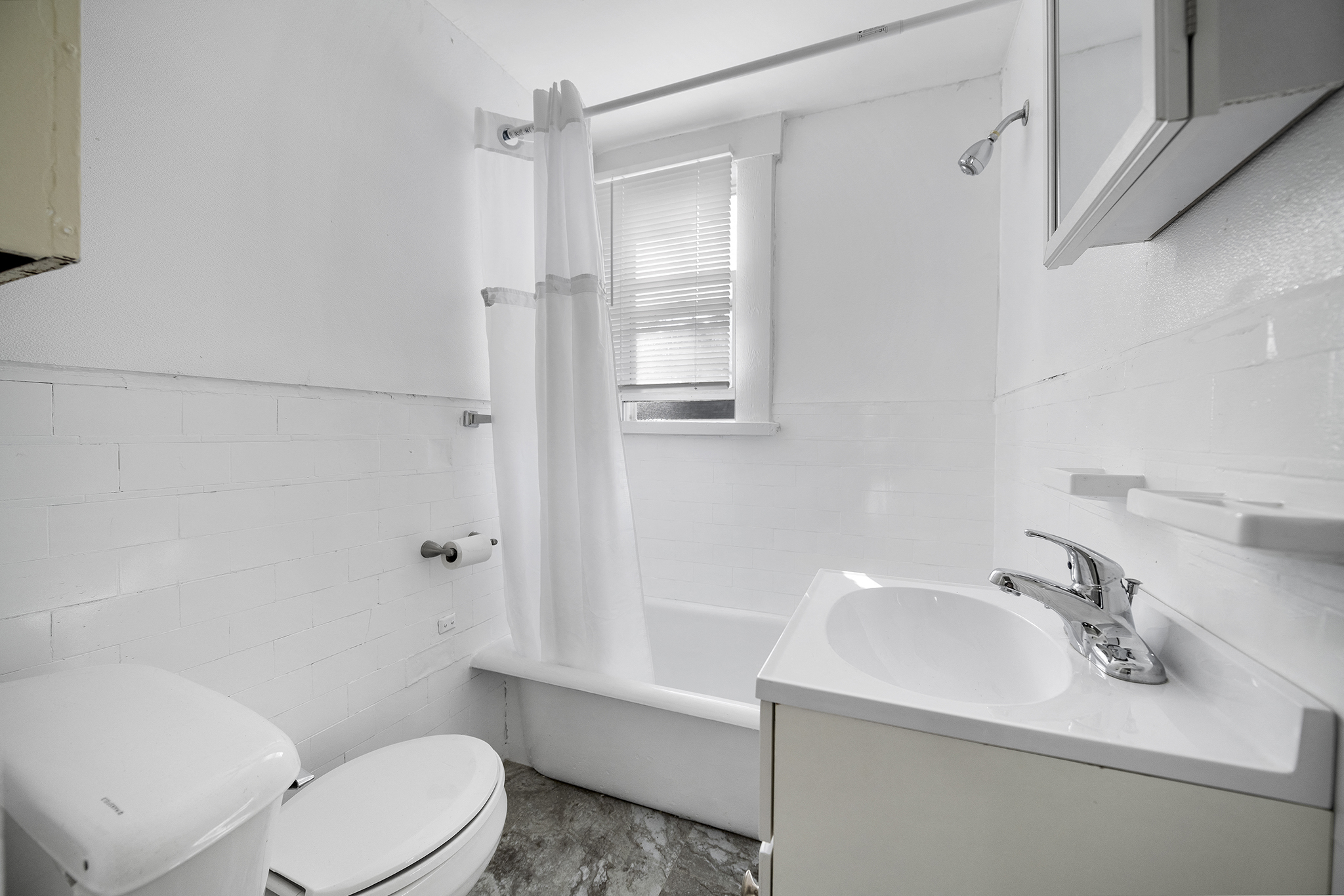 a bathroom with a sink toilet and a shower