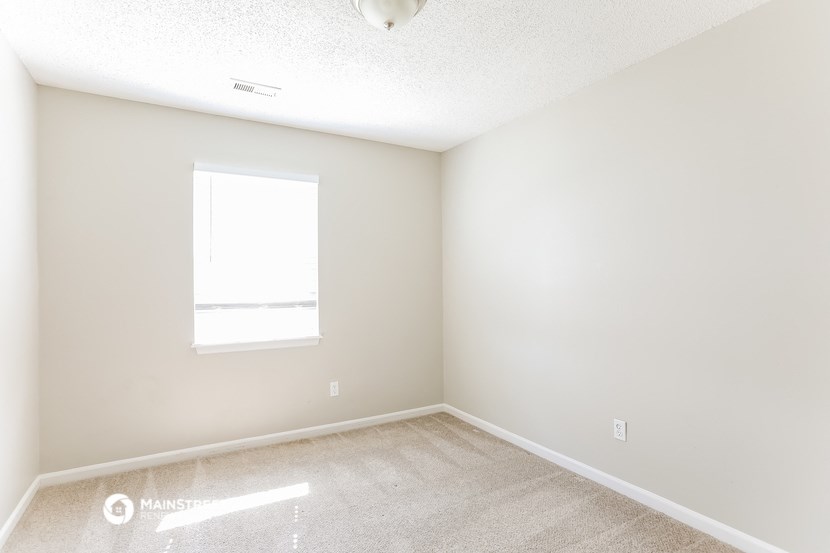 an empty room with a window in it