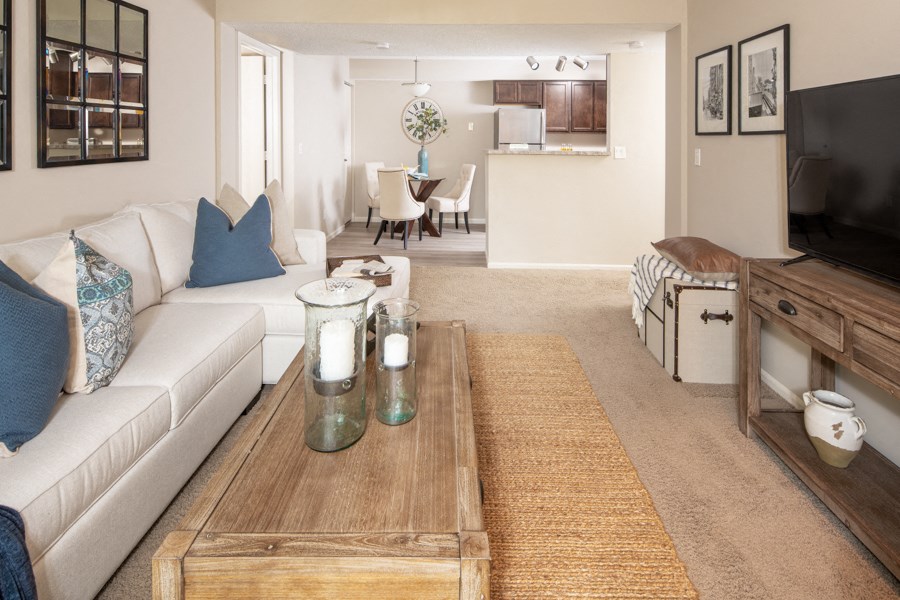 a living room with a white couch and a coffee table