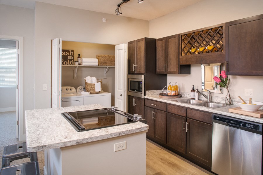 a kitchen with stainless steel appliances and granite counter tops