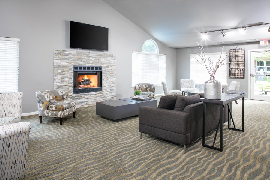 a living room with a fireplace and a table