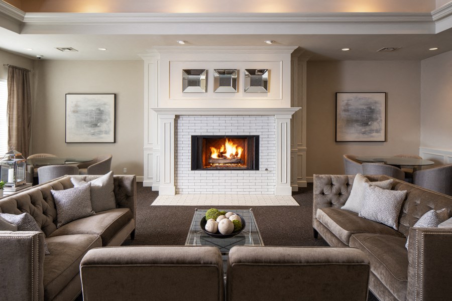 a living room with a fireplace and couches