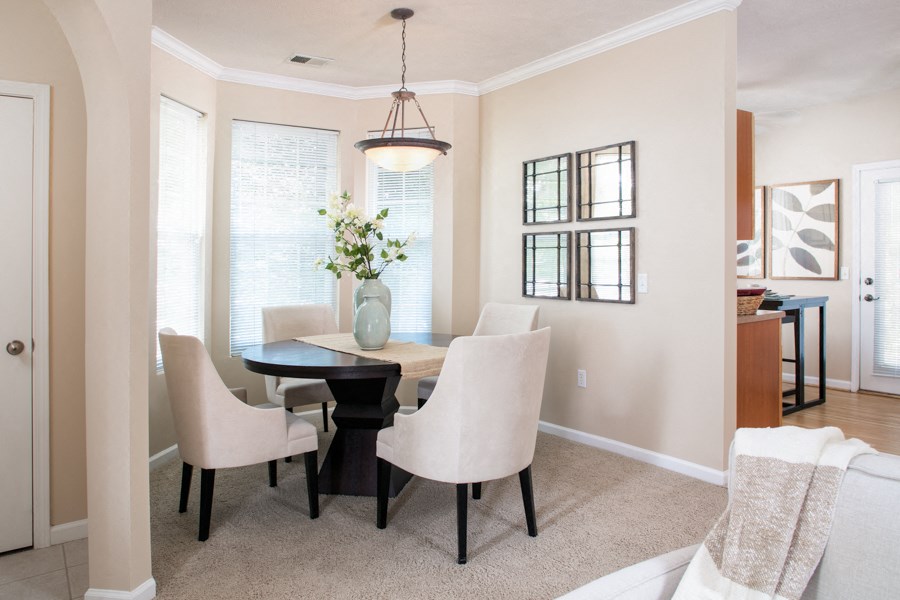a dining room with a table and chairs