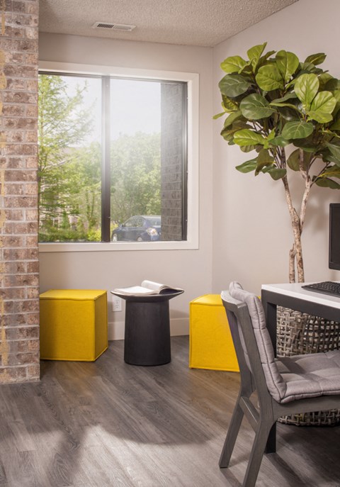 a home office with a desk and a window