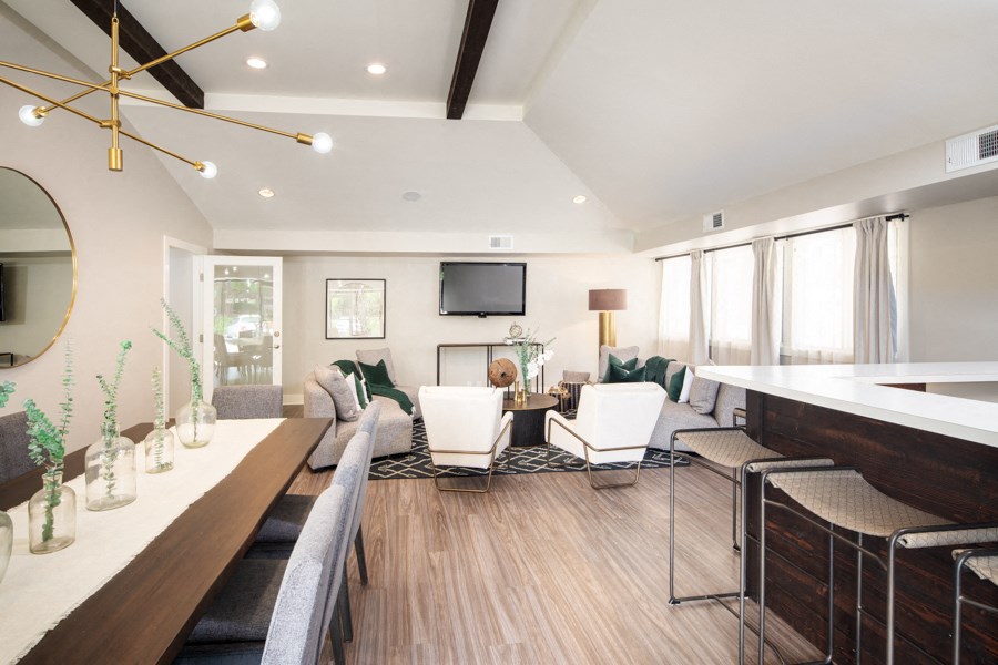 a living room with a couch and chairs and a table