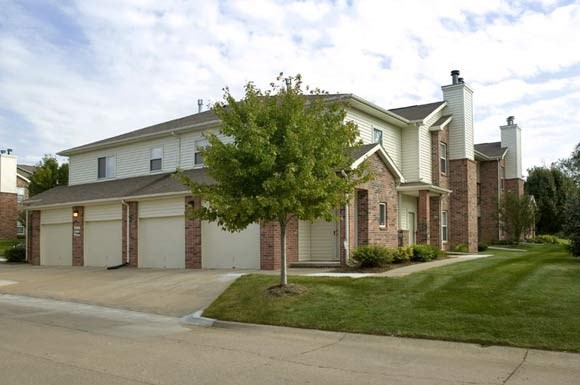 a house with a tree in the front of it