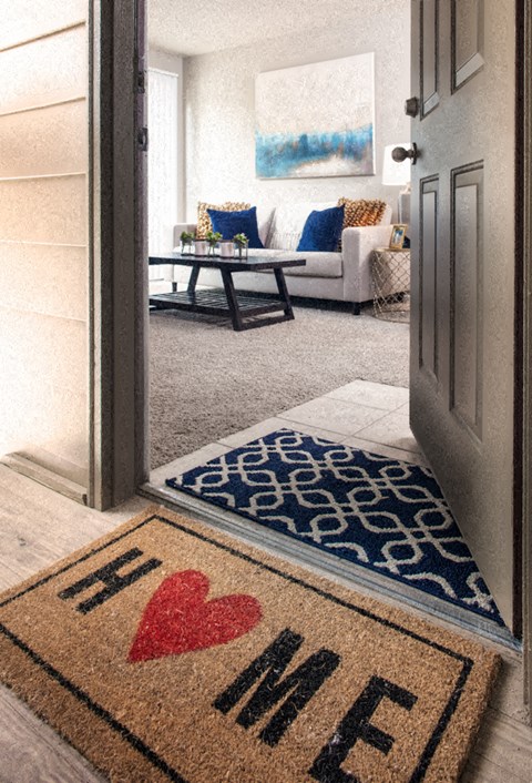 a living room with a rug with a heart on it