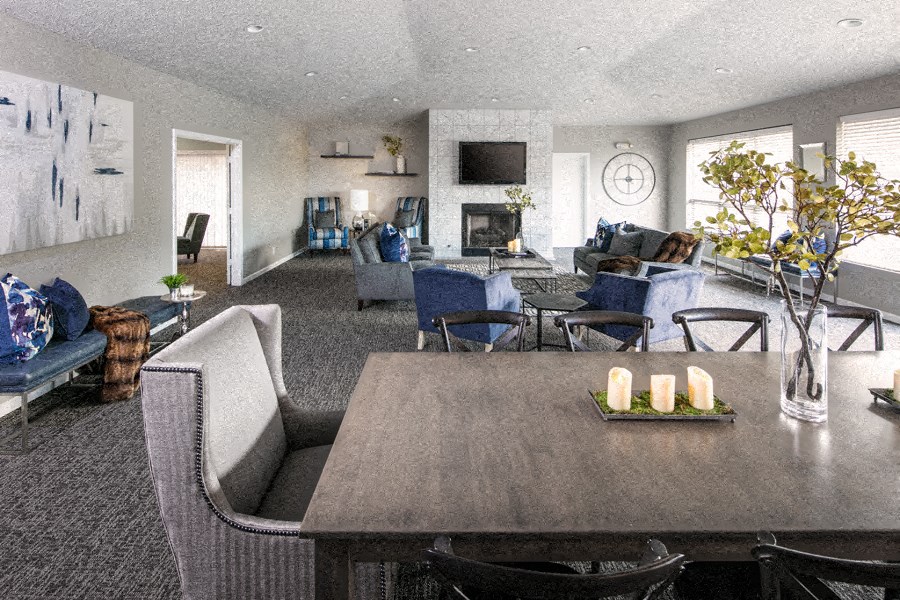 a living room with furniture and a table with candles