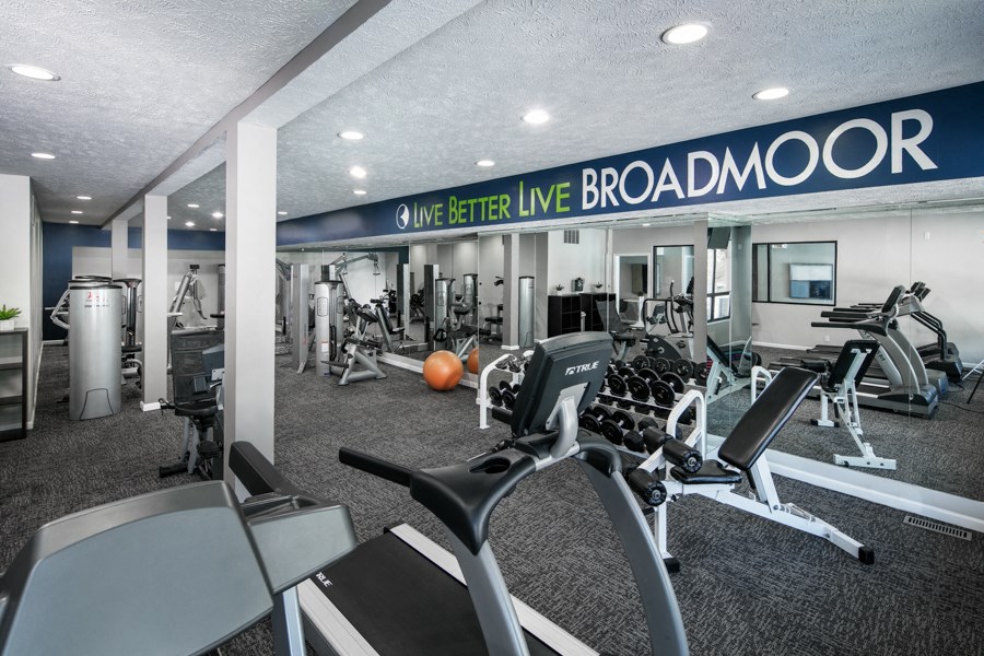 the gym at broadmoor concourse is equipped with cardio equipment and weights