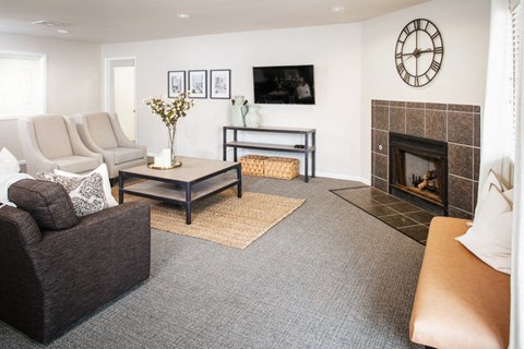 a living room with a couch and a fireplace