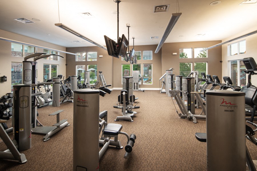 a gym with cardio machines and other exercise equipment