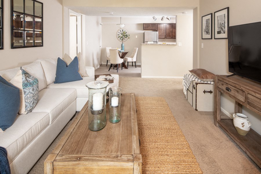 a living room with a white couch and a coffee table