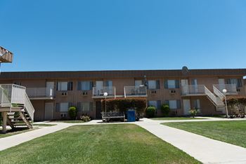 Exterior Building with grass area  l Reseda Village Green Apartments in Reseda, CA