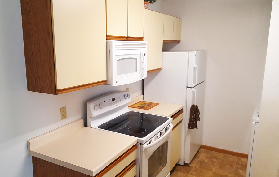 a kitchen with a stove microwave and refrigerator