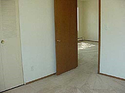an open door in a room with a tile floor