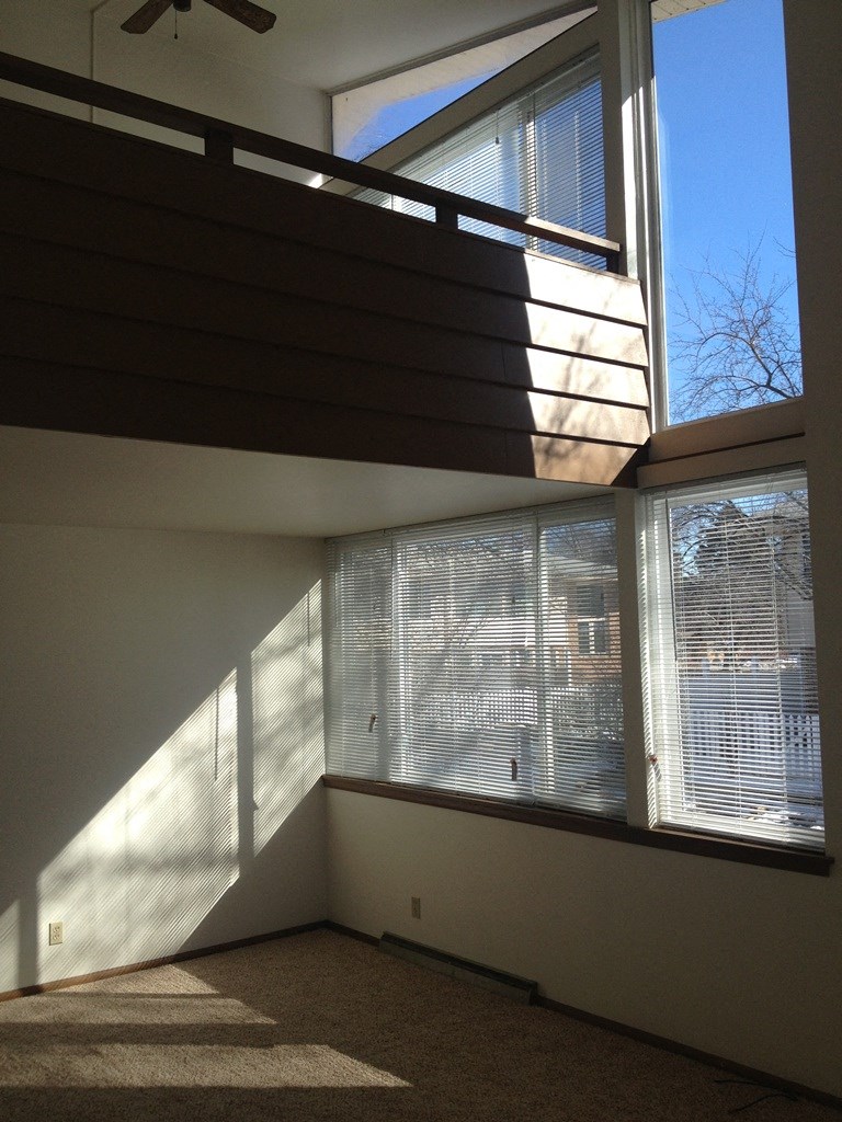 a view of a large window in a room with a staircase