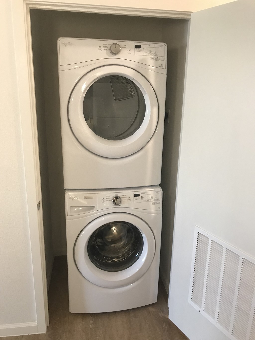 a washing machine and a dryer in a laundry room