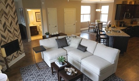 a living room with a white couch and a table